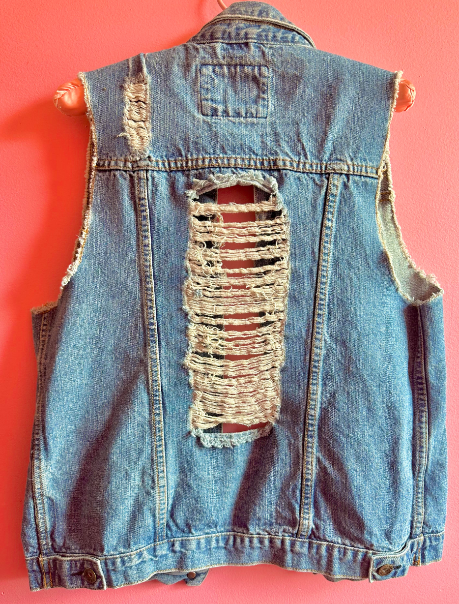 Distressed denim vest