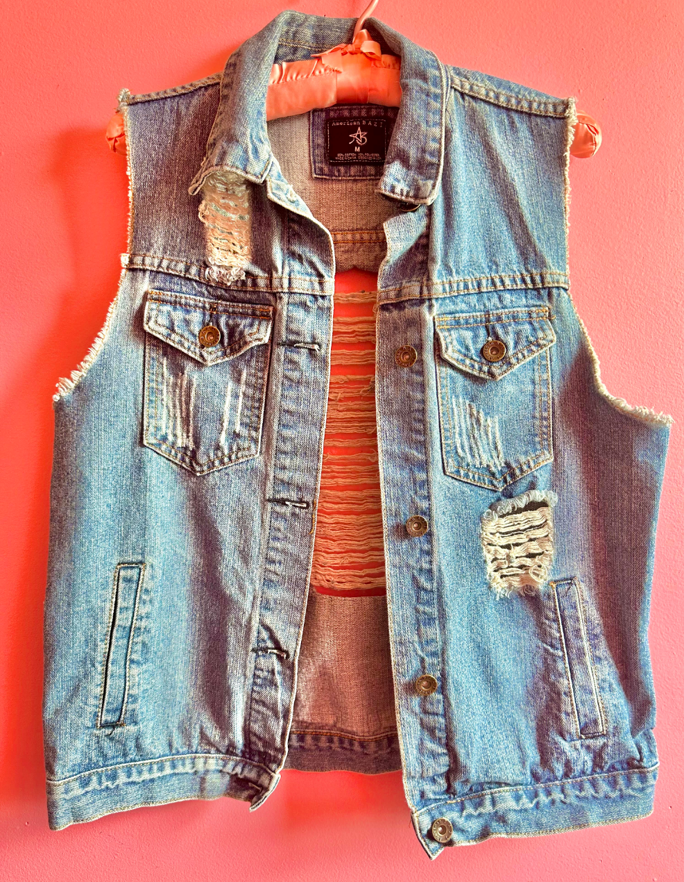 Distressed denim vest